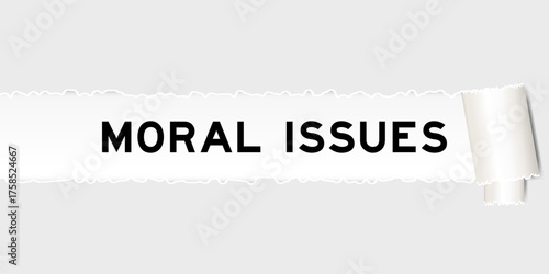 Ripped gray paper background that have word moral issues under torn part