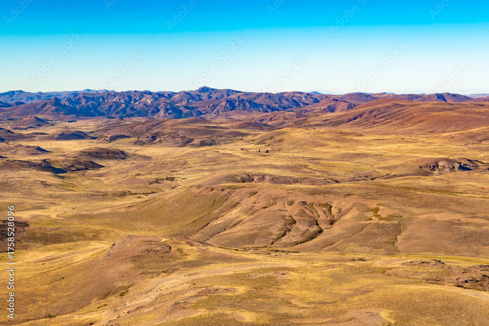 Naklejka premium The rugged beauty of the pampa in the Argentinean Patagonia near San Carlos de Bariloche with its dry terrain and sparse vegetation.