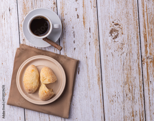 Chipas, typical south american cheese bun with coffee and copy space