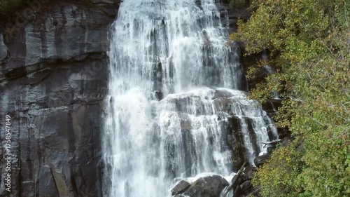 Rising approaching shot of Rainbow Falls, a massive waterfall in the Blue Ridge Mountains of North Carolina.