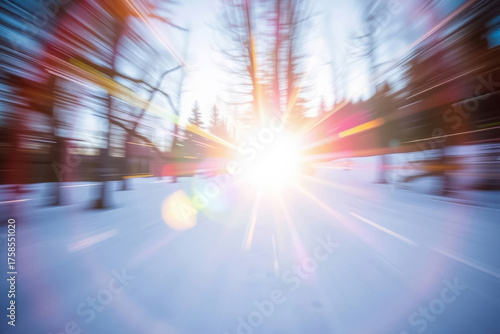 Blinding winter sunlight bursting through a snowy forest landscape with colorful light rays and lens flares, symbolizing warmth, hope, and energy in a serene, frozen nature scene at sunrise or sunset.