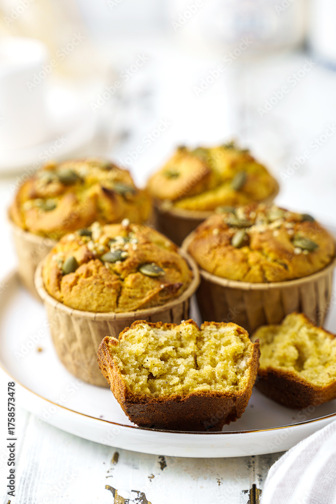 Fototapeta premium pumpkin muffins on a light background on a plate
