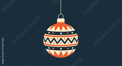 A decorative Christmas ornament hangs suspended against a dark background.