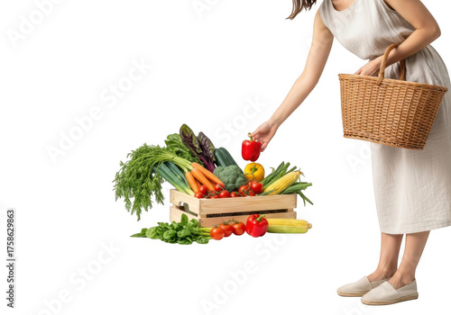 Woman picking fresh vegetables from a wooden crate isolated on transparent background
