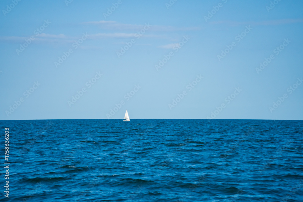 Obraz premium Sporty white yachts on the blue water of the sea. Travel concept