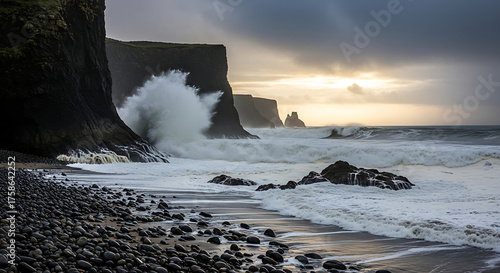 Powerful Ocean Waves Crash Against Dark Cliffs on a Rocky Coastline at Sunset