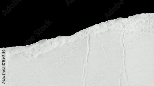 a white piece of paper on a black isolated background
