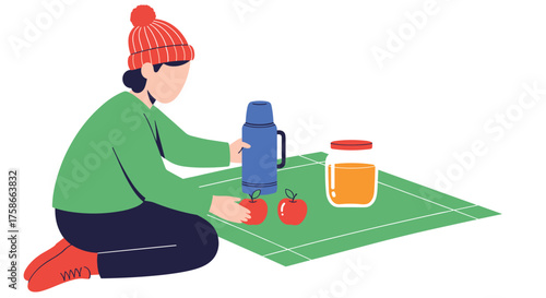 Person preparing a picnic lunch with thermos and fruit