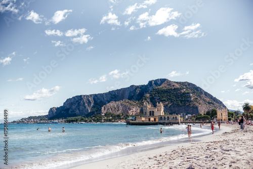 Fototapeta Naklejka Na Ścianę i Meble -  People Enjoying Mondello Beach in Sicily Autumn