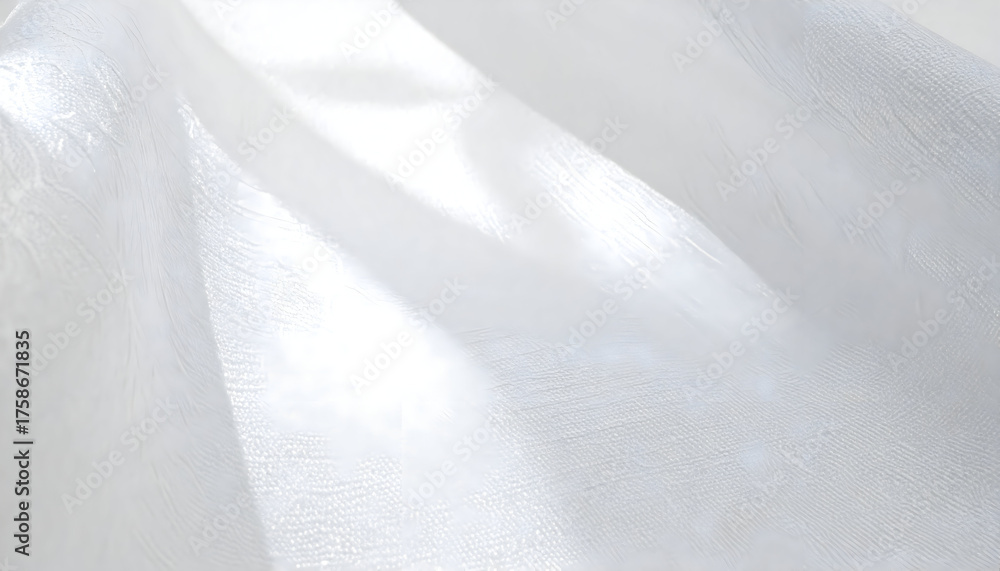 Obraz premium Translucent White Fabric Flowing Gracefully with Soft Light Reflections Creating an Ethereal Atmosphere