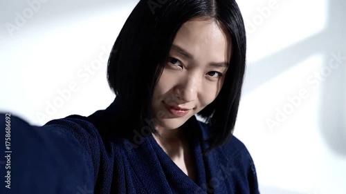 Young Asian Woman Posing for Selfie with Natural Light.