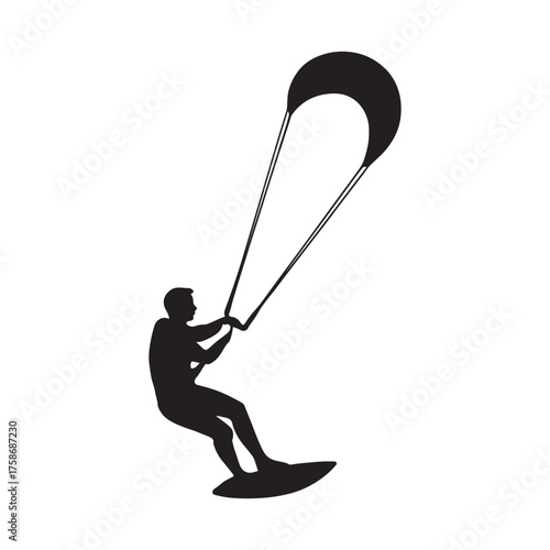 Silhouette of a person kiteboarding on water with a large kite soaring in the sky