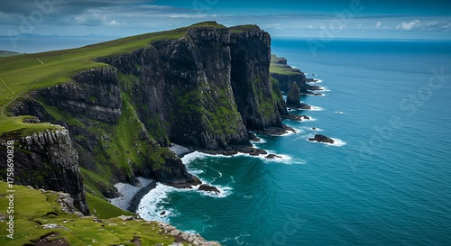 Coastal cliffs meet ocean under a cloudy sky landscape nature