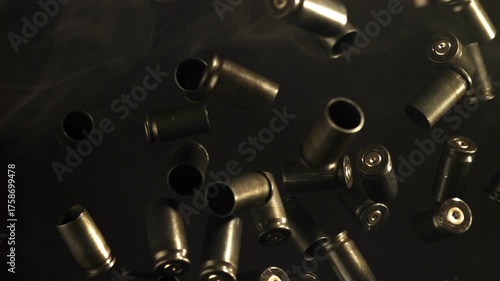 Bullet casings fly up and fall. Filmed on a high-speed camera at 1000 fps. High quality FullHD footage