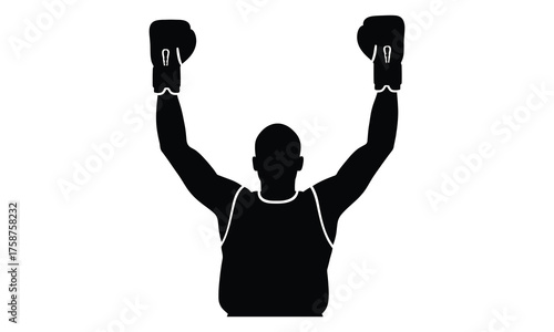 Silhouette of a boxer raising both arms in a triumphant victory stance after winning a match