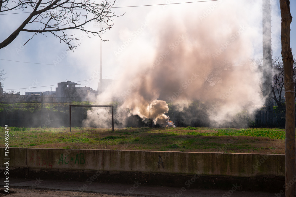 Fototapeta premium Burning Trash Near Stadium in Durres