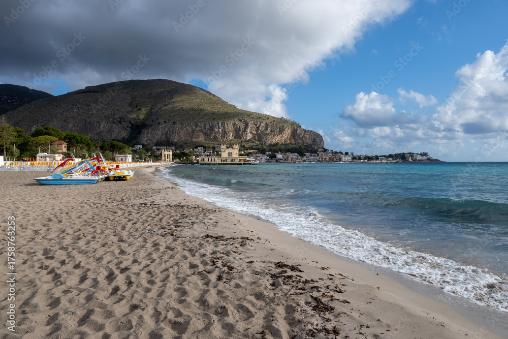 Obraz premium Stormy weather on seaside vacation destination, Mondello Beach, near Palermo in Sicily with fine, golden sand, turquoise waters and charming villas, South of Italy