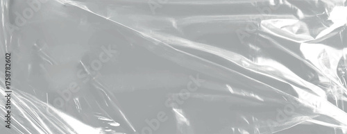 Glossy, transparent plastic background with a smooth texture. The background is predominantly gray, featuring shiny gray highlights. Plastic foil wrap texture background. Gray background vector.