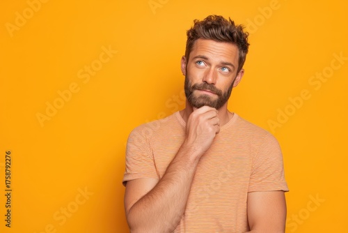 A bearded man with blue eye...