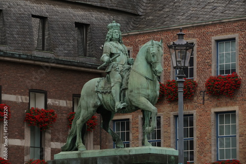 Wall Mural Equestrian Statue Of A King On Horseback In A Brick Town Square, Düsseldorf