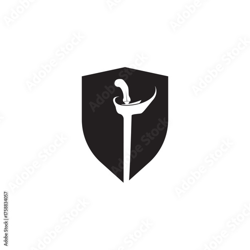 Shield and keris  with its elaborately carved handle and wavy blade