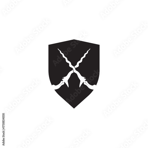 Shield and keris  with its elaborately carved handle and wavy blade