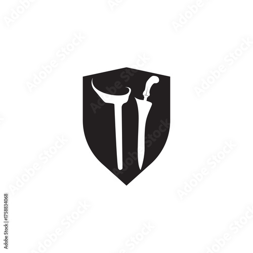 Shield and keris  with its elaborately carved handle and wavy blade