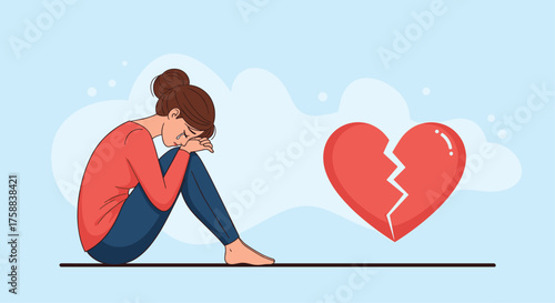 A woman experiencing heartache and sadness after a breakup.