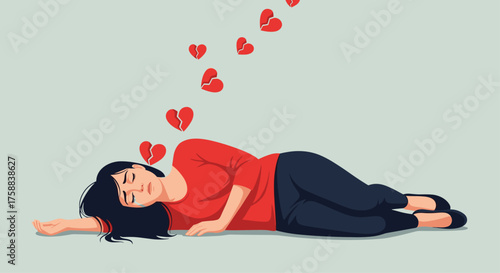 A woman lies on her side with her eyes closed as broken hearts float above her head.