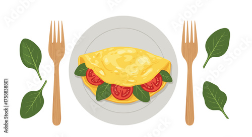 A simple omelette with tomatoes and spinach served with cutlery.
