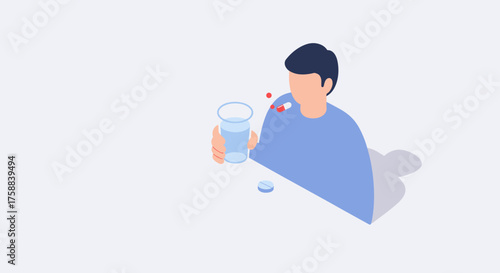 Man taking medication with water while sitting at a table  
