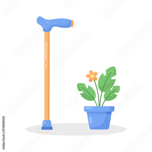 A blue handled walking cane stands next to a potted plant with orange flowers.