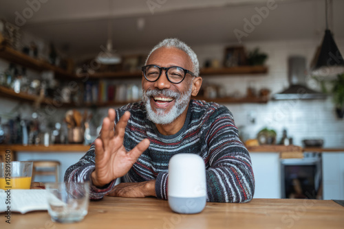 Smiling older man talking to an AI voice assistant smart speaker