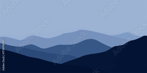 Mountain landscape view with fog, mist, and clouds at sunrise