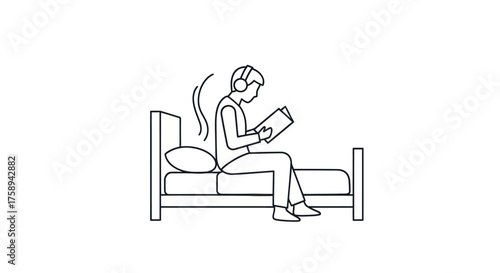 Person sitting on a bed wearing headphones and reading a book.