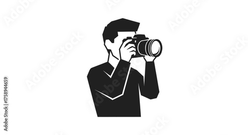 Silhouette of a person holding a professional camera and taking a photo.