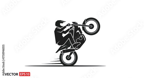 Silhouette of a motorcyclist performing a wheelie on a dirt bike.