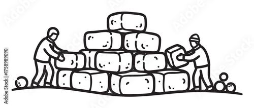 Two individuals stacking large rectangular blocks into a pyramid shape, wearing warm clothing, possibly engaging in outdoor labor or construction.
