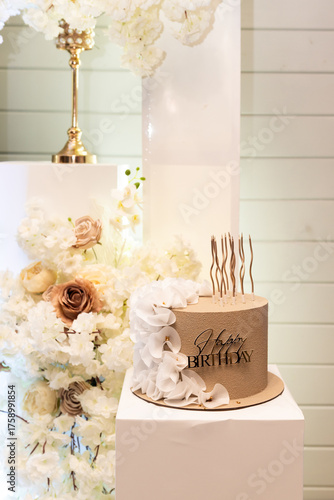 Birthday cake and flower decorations. Photo zone