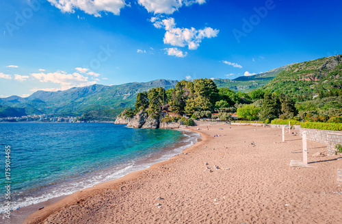 Ivano Vidoni beach, that stretches for approximately 400 meters in the picturesque region of Sveti Stefan, in Montenegro. Pristine sands, azure waters and stunning views of the Adriatic Sea