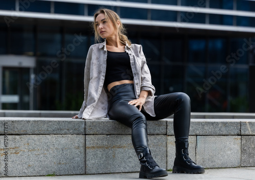 Beautiful Woman Posing in Leather Pants, Modern Style in City Geometry