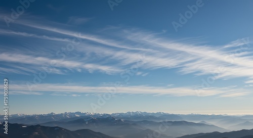 Wallpaper Mural Panoramic view of mountain range under a bright blue sky with wispy clouds Torontodigital.ca
