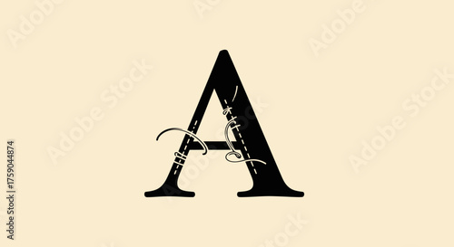 Letter A, stylized with stitching and a thread on a cream background