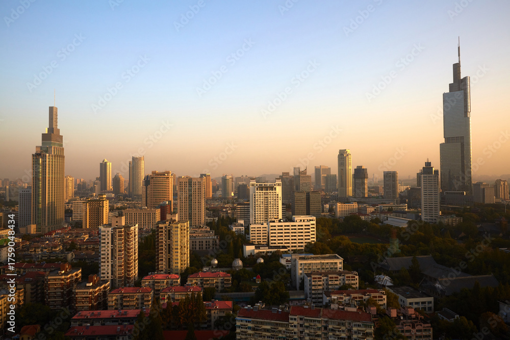 Naklejka premium Aerial view of Zifeng Tower and Nanjing city skyline sunrise, China