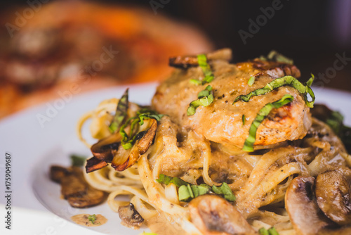 Tableau sur toile A plate of chicken marsala at an upscale Italian food restaurant