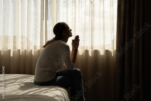 Obraz na plátně Desperate woman hands together saying a prayer to god for help