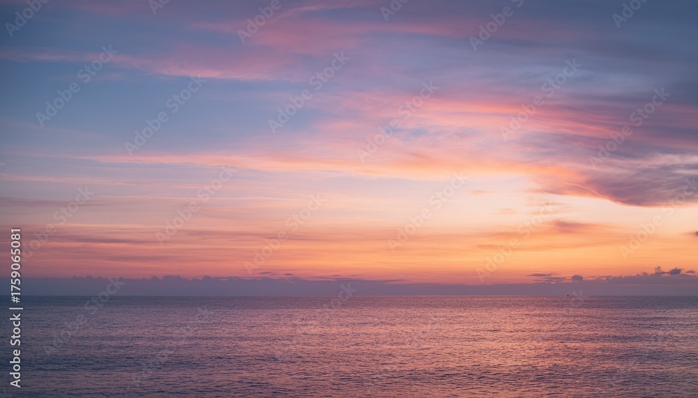 Fototapeta premium Evening sky with pink cirrus clouds over calm ocean water at sunset 