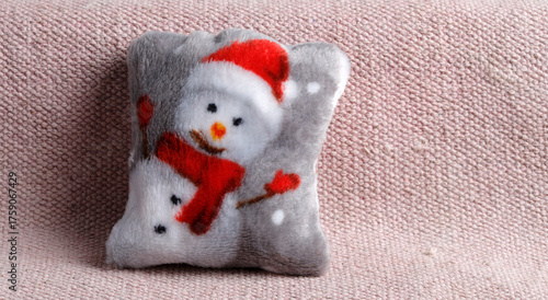 Cushion with snowmann on a sofa