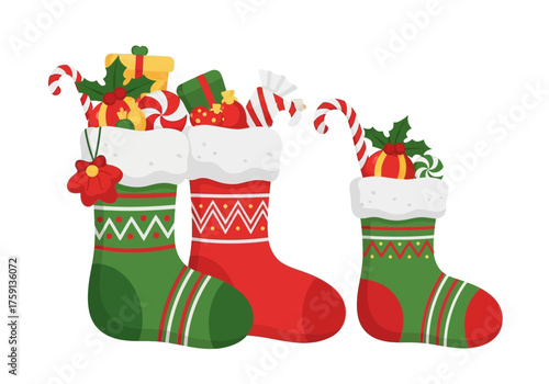 Three Christmas stockings filled with gifts and candy sit against a white background