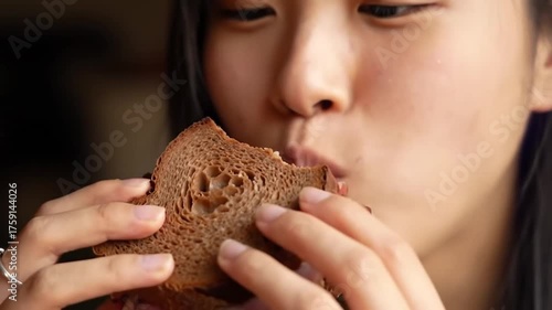 woman eating sandwich